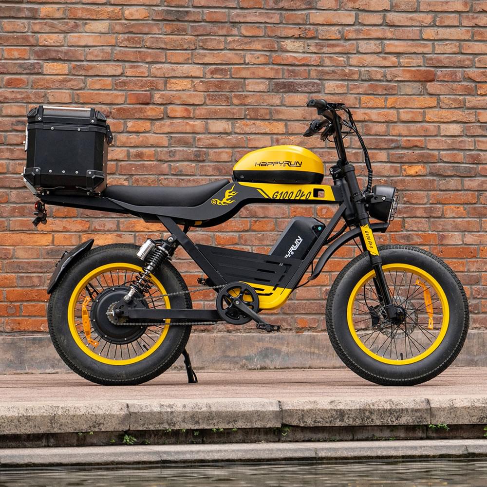 outdoor display of Yellow HappyRun G100 Pro Dual battery Electric Cargo Bikes. Off-road, all terrain E-bikes with 72V 6000W motor system, fat-tire cruisers to sleek urban commuters. NFC unlock and LED Display, Hydraulic disc drakes, Full Suspension. HappyRun G100 e-bike is similar to Freego Flash F3 Pro Max Dual Motor 750W eBike 55Ah Battery 34 MPH, Voltvogue BK-20 Adult Electric Bike, Segway Xyber Electric Bike, Freego Flash F3 Pro Max Electric Bike, Cheetah MT-380 Dual-Motor Electric Motorbike.