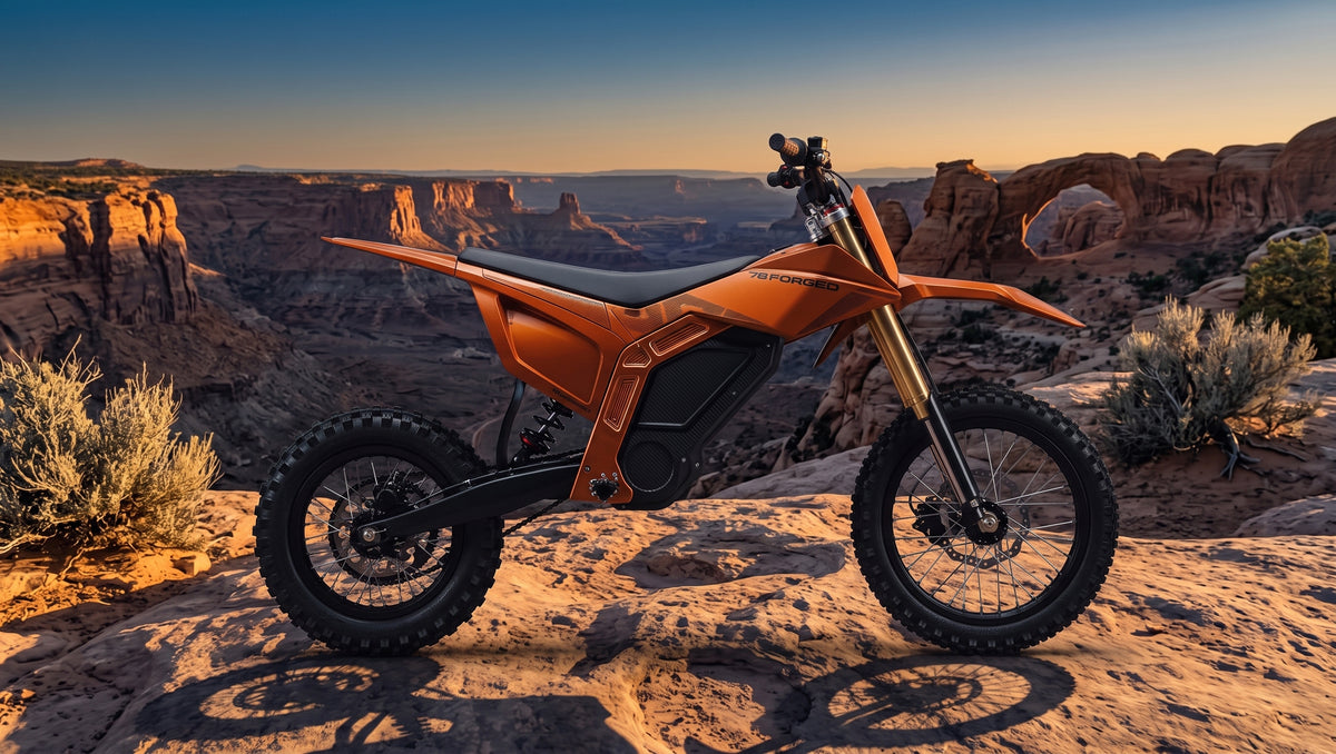 An orange electric dirt bike with black tires and a black seat is parked on a rocky desert canyon ledge at sunset, with canyon rock formations and sparse shrubs in the background. electric dirt bike

ebike moto

electric pit bike

light electric motorcycle

off road electric bike

adult electric dirt bike

high performance e-dirt bike surron alternative

talaria vs surron

best electric pit bike for adults

custom electric dirt bike builds

street legal electric dirt bike

forged frame electric moto long ra