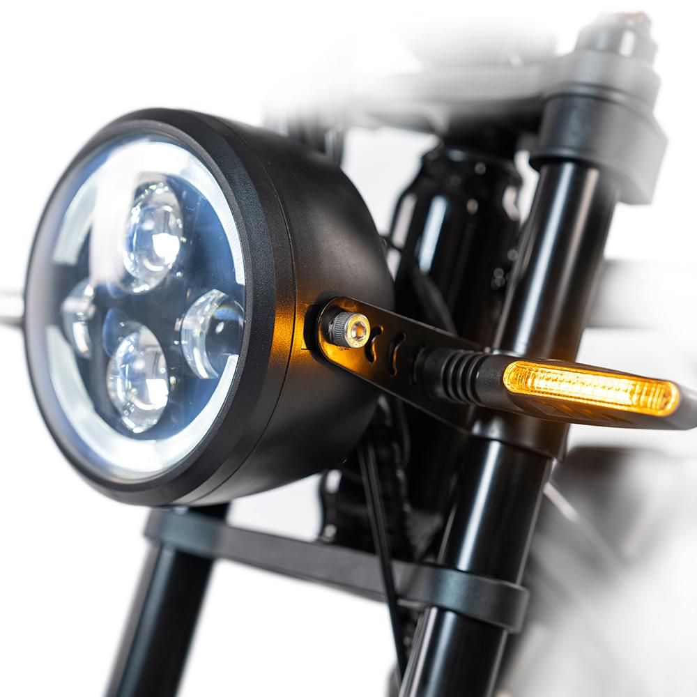 Headlight of  HappyRun G70 750W fat-tire electric cargo bike in matte black color, Adult e-bike featuring a dual battery setup, powerful dual-motor system, aluminum alloy cargo-ready frame, front suspension fork, padded rear cargo seat with backrest, integrated rear cargo rack, hydraulic disc brakes,7-speed, front LED headlight, and backlit LCD display, Class 3 electric bike built for hauling gear and long-range rides. Similar to Macfox Electric Bicycle 48V 500w E-Bike - X7.
