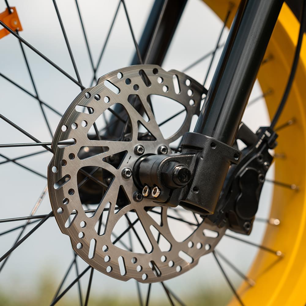Disc brake of yelow HappyRun G100 Pro Dual battery Electric Cargo Bikes. Off-road, all terrain E-bikes with 72V 6000W motor system, fat-tire cruisers to sleek urban commuters. NFC unlock and LED Display, Hydraulic disc drakes, Full Suspension. HappyRun G100 e-bike is similar to Freego Flash F3 Pro Max Dual Motor 750W eBike 55Ah Battery 34 MPH, Voltvogue BK-20 Adult Electric Bike, Segway Xyber Electric Bike, Freego Flash F3 Pro Max Electric Bike, Cheetah MT-380 Dual-Motor Electric Motorbike.