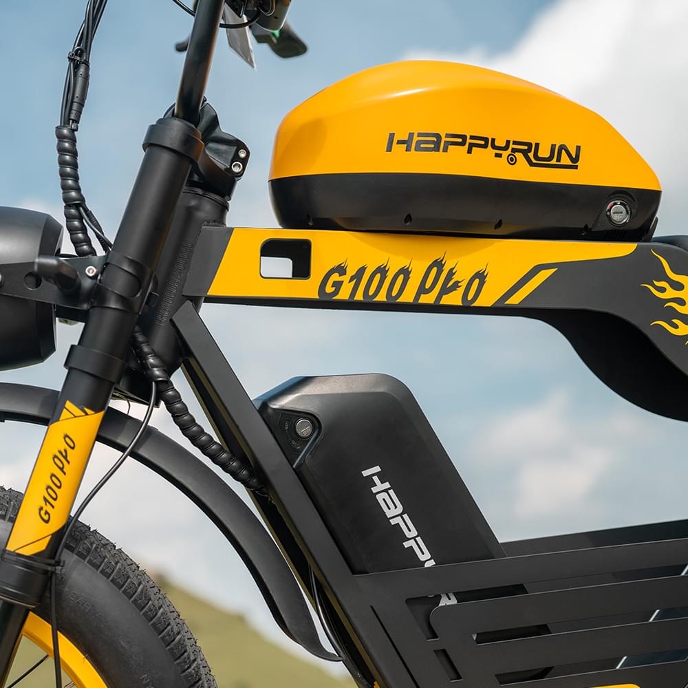 Close-up view of Yellow HappyRun G100 Pro Dual battery Electric Cargo Bikes. Off-road, all terrain E-bikes with 72V 6000W motor system, fat-tire cruisers to sleek urban commuters. NFC unlock and LED Display, Hydraulic disc drakes, Full Suspension. HappyRun G100 e-bike is similar to Freego Flash F3 Pro Max Dual Motor 750W eBike 55Ah Battery 34 MPH, Voltvogue BK-20 Adult Electric Bike, Segway Xyber Electric Bike, Freego Flash F3 Pro Max Electric Bike, Cheetah MT-380 Dual-Motor Electric Motorbike.