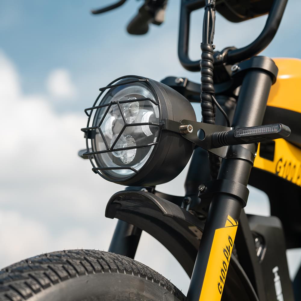 Front view of yellow HappyRun G100 Pro Dual battery Electric Cargo Bikes. Off-road, all terrain E-bikes with 72V 6000W motor system, fat-tire cruisers to sleek urban commuters. NFC unlock and LED Display, Hydraulic disc drakes, Full Suspension. HappyRun G100 e-bike is similar to Freego Flash F3 Pro Max Dual Motor 750W eBike 55Ah Battery 34 MPH, Voltvogue BK-20 Adult Electric Bike, Segway Xyber Electric Bike, Freego Flash F3 Pro Max Electric Bike, Cheetah MT-380 Dual-Motor Electric Motorbike.