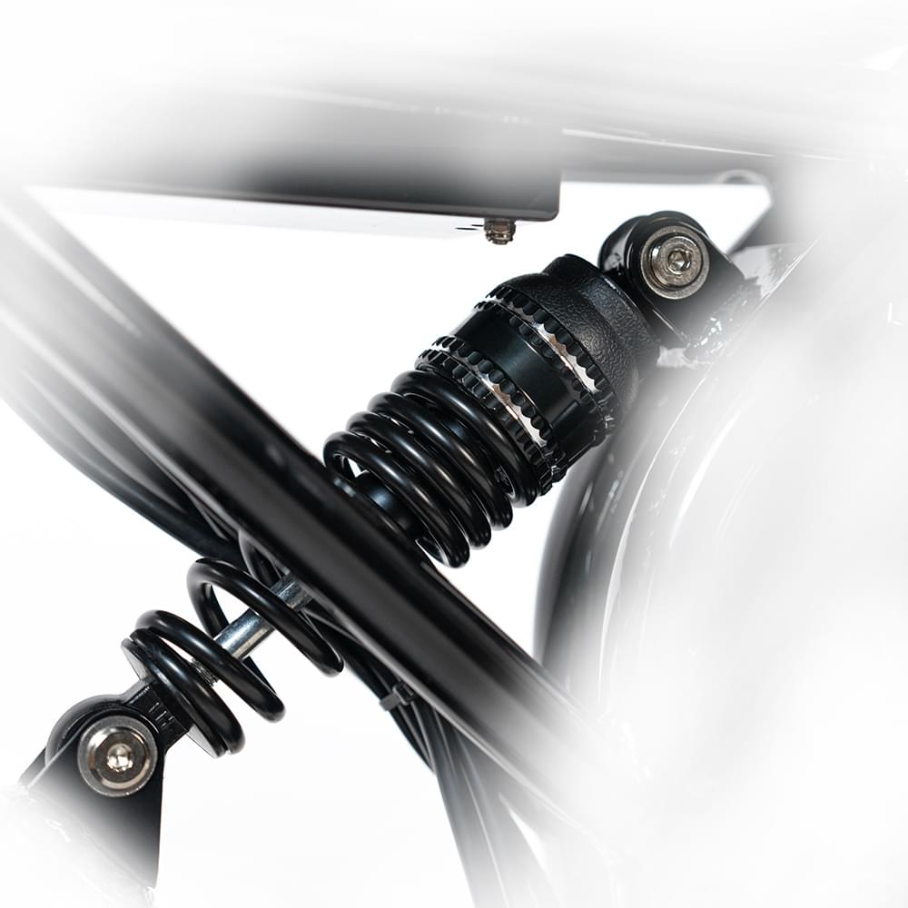 Suspension system of HappyRun G70 750W fat-tire electric cargo bike in matte black color, Adult e-bike featuring a dual battery setup, powerful dual-motor system, aluminum alloy cargo-ready frame, front suspension fork, padded rear cargo seat with backrest, integrated rear cargo rack, hydraulic disc brakes,7-speed, front LED headlight, and backlit LCD display, Class 3 electric bike built for hauling gear and long-range rides. Similar to Macfox Electric Bicycle 48V 500w E-Bike - X7.