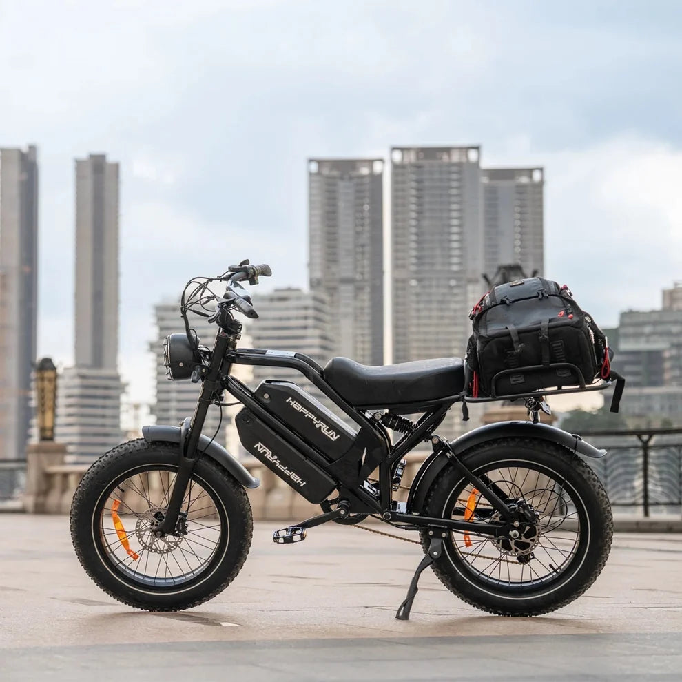 HappyRun G70 750W fat-tire electric cargo bike in matte black color, Adult e-bike featuring a dual battery setup, powerful dual-motor system, aluminum alloy cargo-ready frame, front suspension fork, padded rear cargo seat with backrest, integrated rear cargo rack, hydraulic disc brakes,7-speed, front LED headlight, and backlit LCD display, Class 3 electric bike built for hauling gear and long-range rides. Similar to Macfox Electric Bicycle 48V 500w E-Bike - X7, KETELES Electric Bike for Adult.