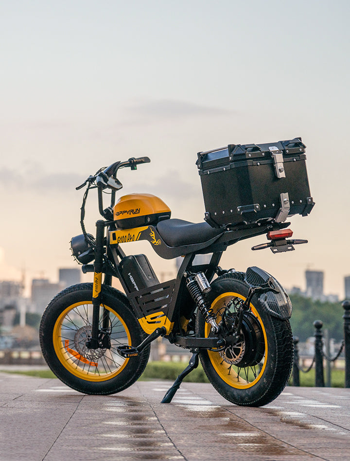 Cargo Display of yellow HappyRun G100 Pro Dual battery Electric Cargo Bikes. Off-road, all terrain E-bikes with 72V 6000W motor system, fat-tire cruisers to sleek urban commuters. NFC unlock and LED Display, Hydraulic disc drakes, Full Suspension. HappyRun G100 e-bike is similar to Freego Flash F3 Pro Max Dual Motor 750W eBike 55Ah Battery 34 MPH, Voltvogue BK-20 Adult Electric Bike, Segway Xyber Electric Bike, Freego Flash F3 Pro Max Electric Bike, Cheetah MT-380 Dual-Motor Electric Motorbike.